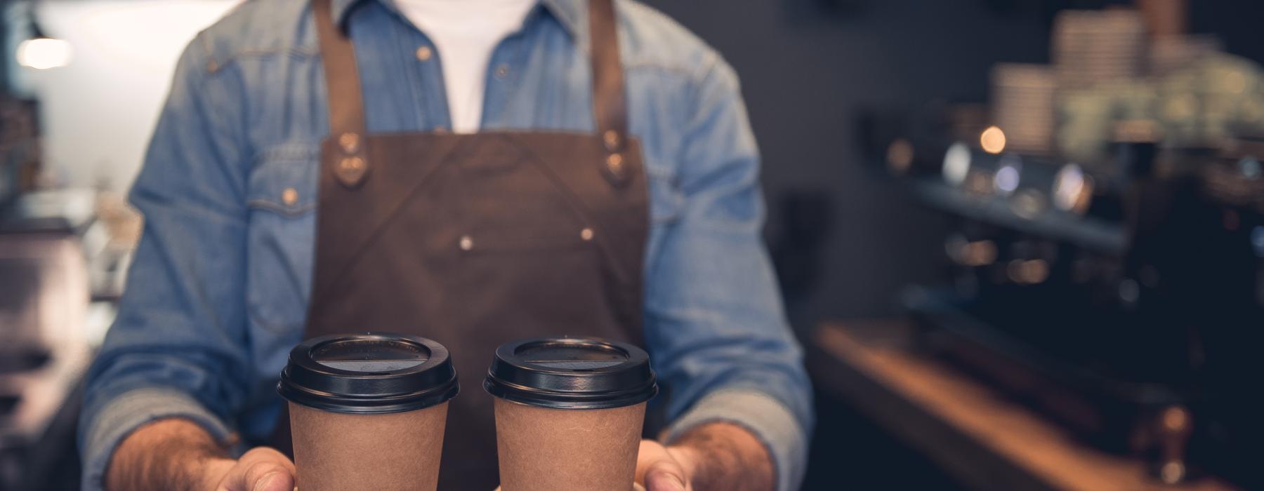 a man holding coffee